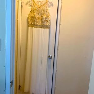 Beaded bodice, A shape gown with lined skirt, it has a long slit on the side.